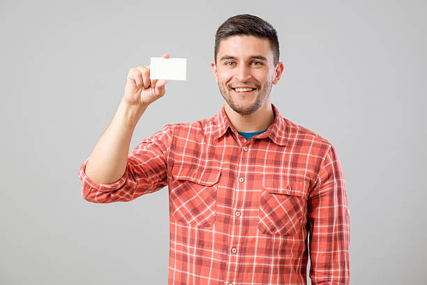 istock Man showing blank business card 635477000