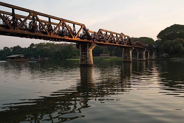 bridge on the river khwae, kanchanaburi, thailand - kwai river kanchanaburi province bridge thailand imagens e fotografias de stock