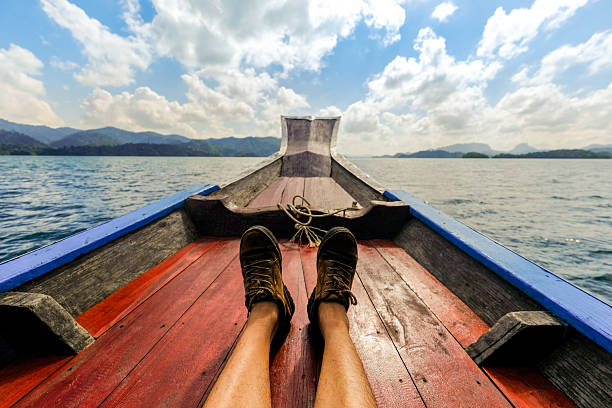 istock Male's feet relaxing on a boat. 635480208