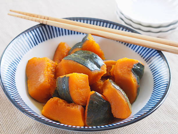 japanese simmerd pumpkin japanese simmerd pumpkin kabocha stock pictures, royalty-free photos & images