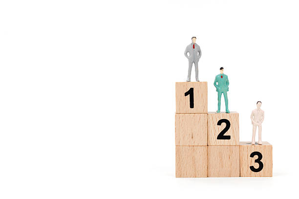 istock Group of miniature businessman on white background 635671528