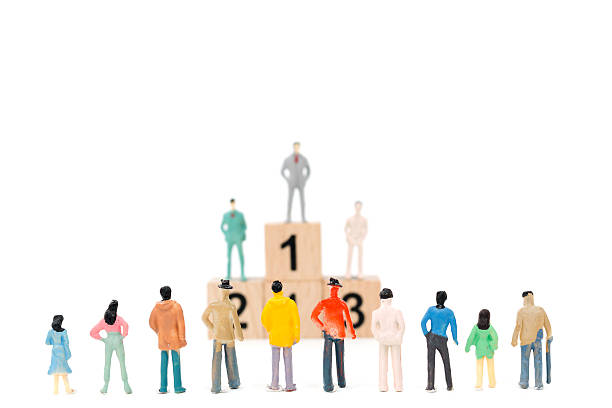 istock Group of miniature businessman on white background 635671646
