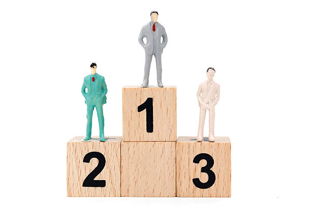 istock Group of miniature businessman on white background 635671746