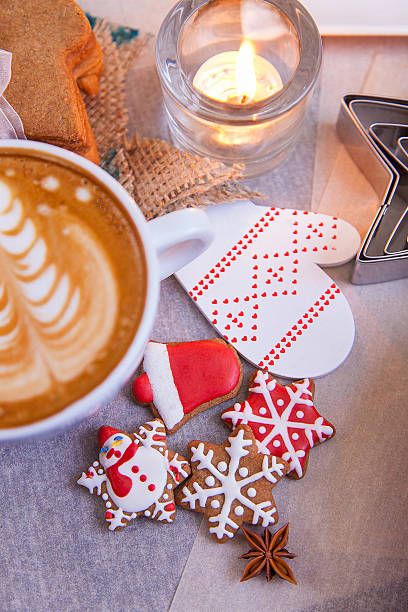 istock Coffee and Christmas cookies in hand mittens 635671830