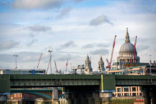 istock Train moving on bridge and St Paul's Cathedral at distance 635672060