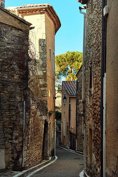 charming narrow street of venasque. france - venasque imagens e fotografias de stock