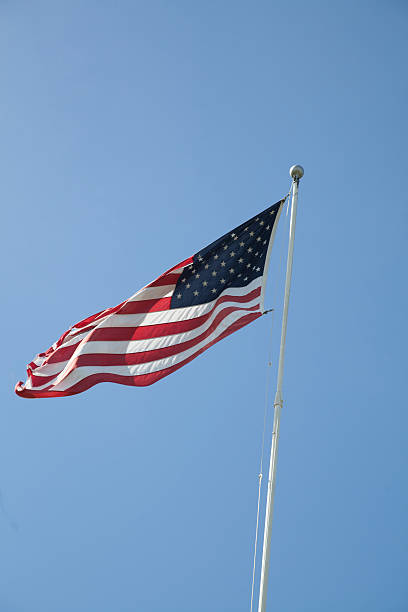 istock American Flag Flapping in the Wind 635674190