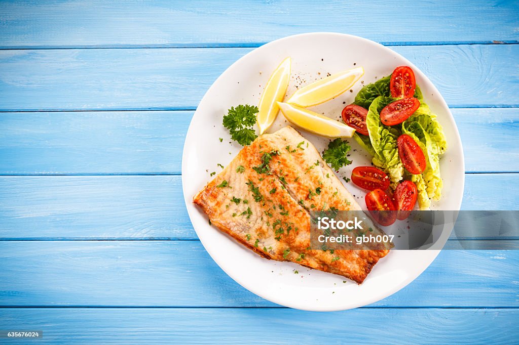 Fried cod fillets and vegetables Fish dish Fish Stock Photo