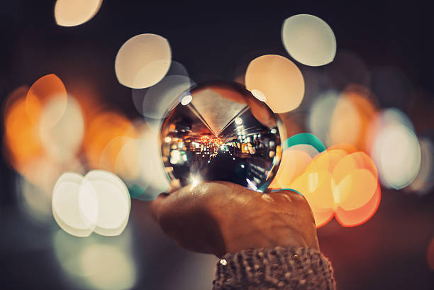 istock Girl holding crystal ball 635676312