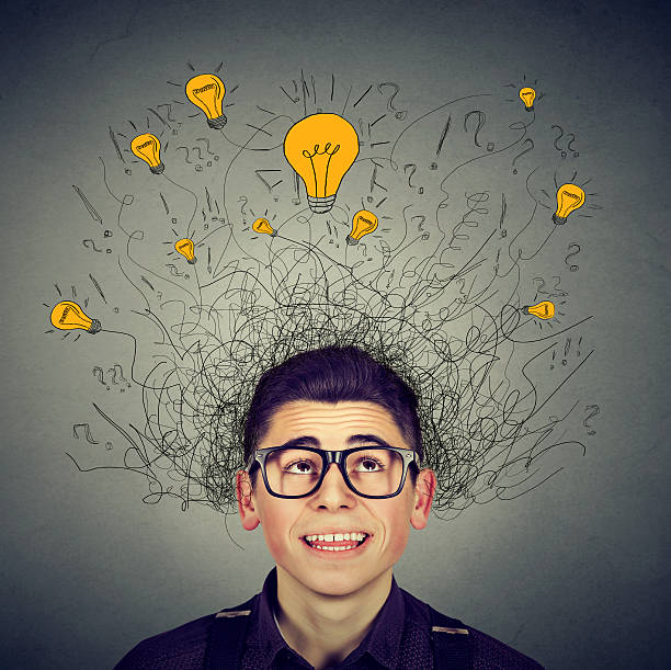 istock Brain connections. Man with ideas light bulbs above head 635676530