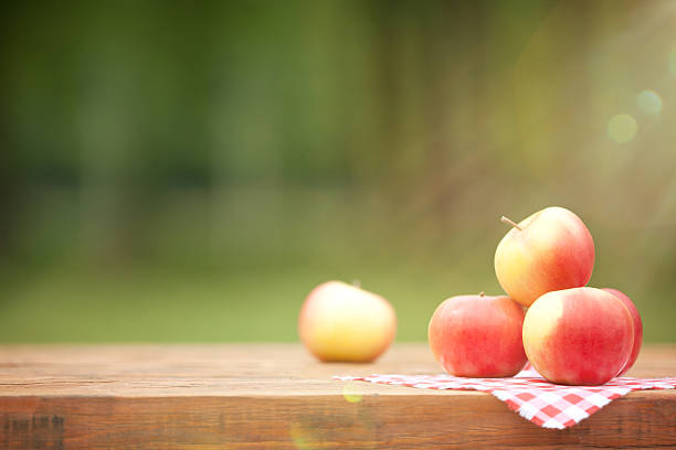 Fresh Yellow Red Apples on Wooden Table