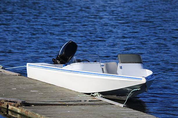 istock Speed boat tied to a pier 635680104