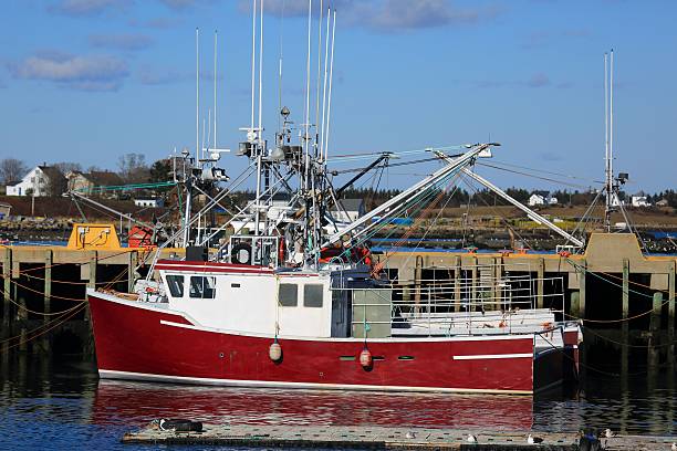 istock Fishing boat at a wharf 635680272