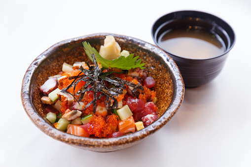 Mixed Donburi : Diced Salmon, Diced Tentacle Squid, Diced Maguro, Diced Unagi, Diced Cucumber with Ebiko and Seaweed Topping on Japanese Steamed Rice that Served with Prickled Ginger and Miso Soup.