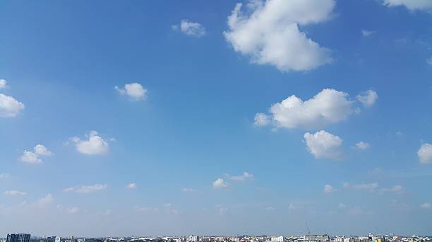 istock Scatter clouds above the city skyline. 635680628