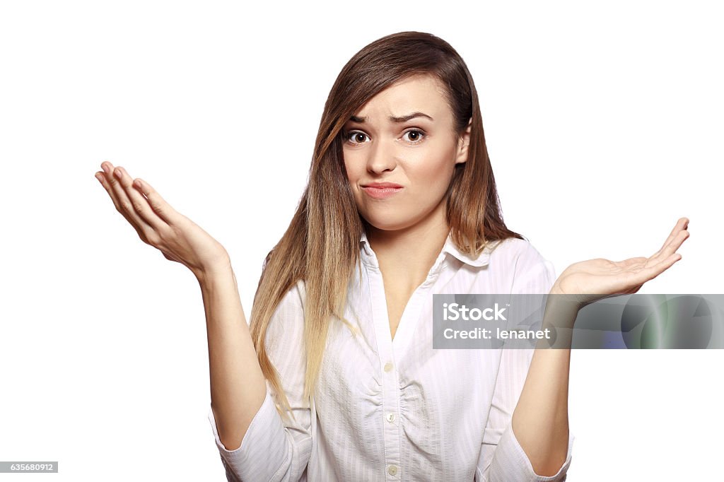 i can't help you portrait of young woman shrugging her hands isolated on white background in photostudio Shrugging Stock Photo