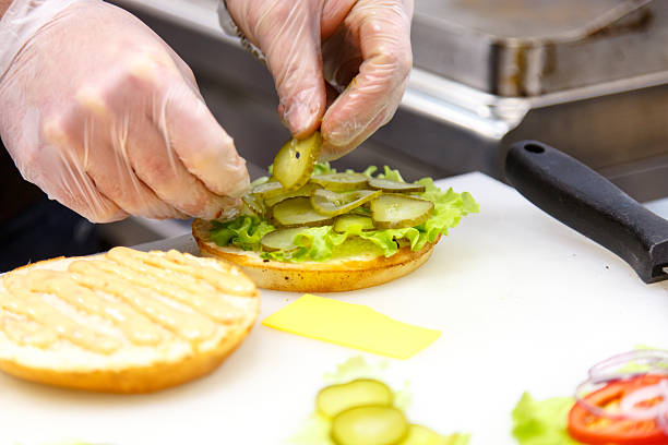 istock The cook prepares the hamburgers 635681682