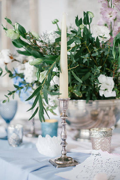 istock Silver candlestick as element of festive table wedding decorations. 635683304