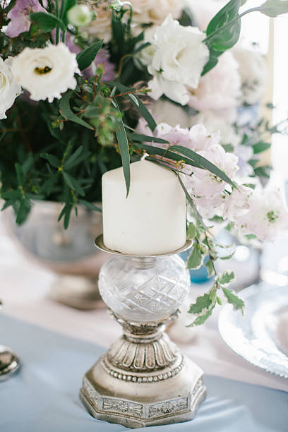 istock Silver candlestick as element of festive table wedding decorations. 635683342