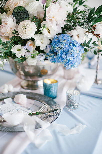 istock Beautiful wedding flowers composition and silver plate with cutlery. 635683458