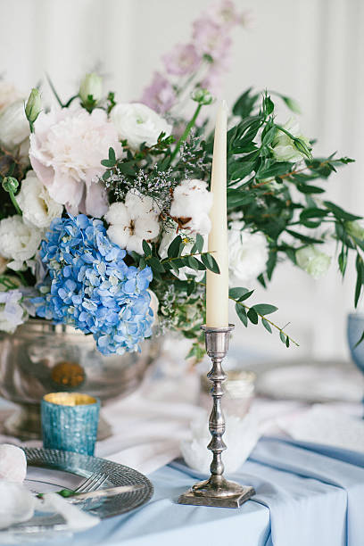 istock Silver candlestick as element of festive table wedding decorations. 635683526
