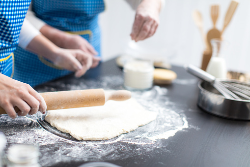Woman rolling the dough