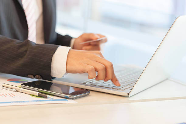 istock Businessman doing online banking. 635695532