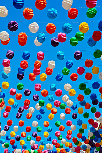 Paper Lanterns on blue sky background at the celebration in Ronda, Malaga (Andalusia), Spain.