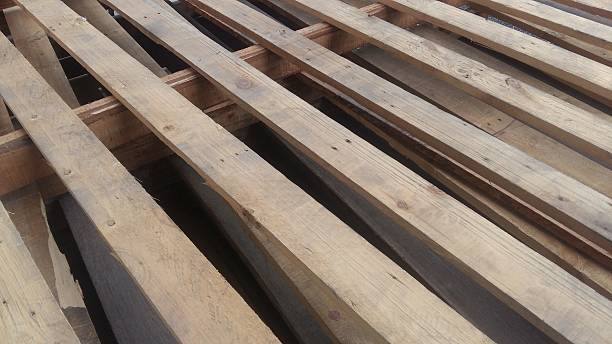 istock Wooden pallets are stacked for use 635697474