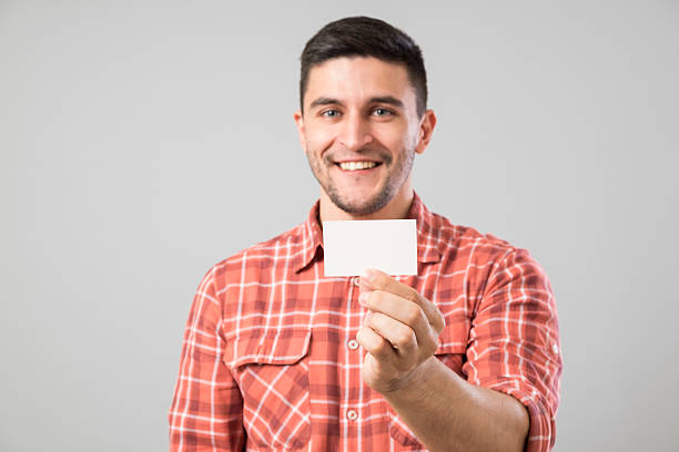 istock Man showing blank business card 635697658