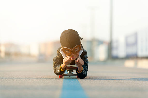 istock Young Boy Imagines Flying On Skateboard 635697962