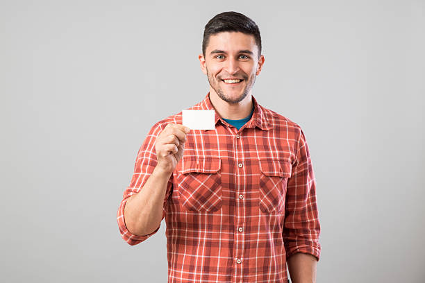 istock Man showing blank business card 635698310