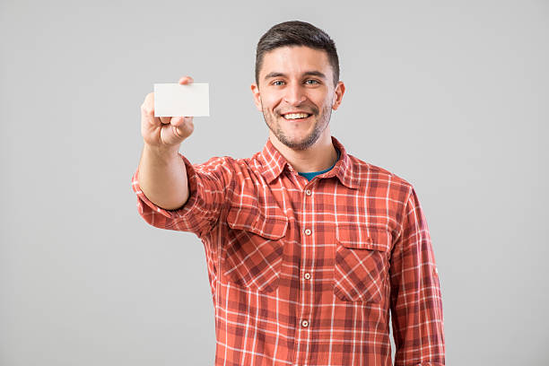 istock Man showing blank business card 635698450
