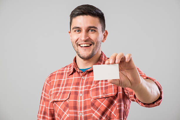 istock Man showing blank business card 635698636