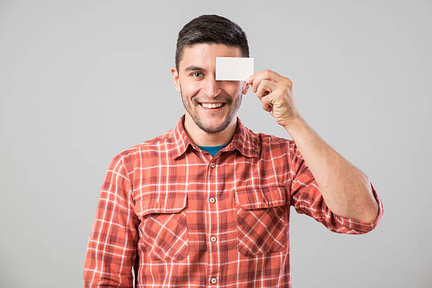 istock Man showing blank business card 635698686