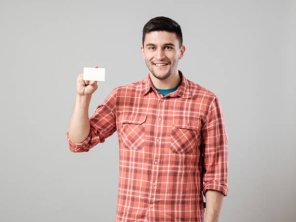 istock Man showing blank business card 635699074