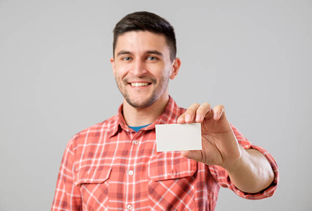 istock Man showing blank business card 635699158