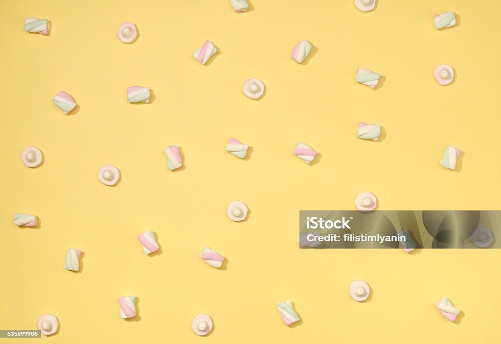 Marshmallows flat lay Sweet marshmallows minimalism set on pastel straw yellow color background Abstract Stock Photo