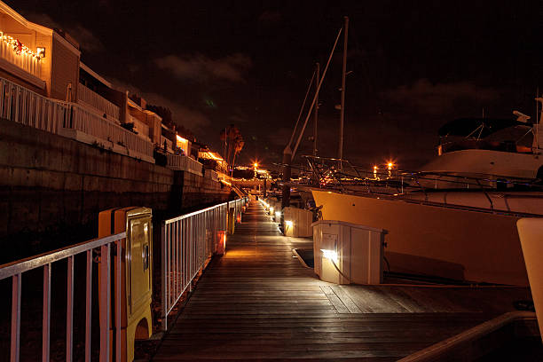 istock Colorful holiday lights on a boardwalk 635701294