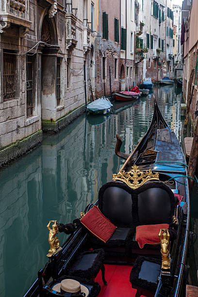 istock Venice  Italy, narrow channel with boat 635702490