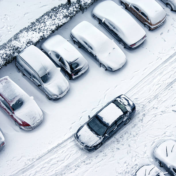 istock driving in snowy winter 635702800