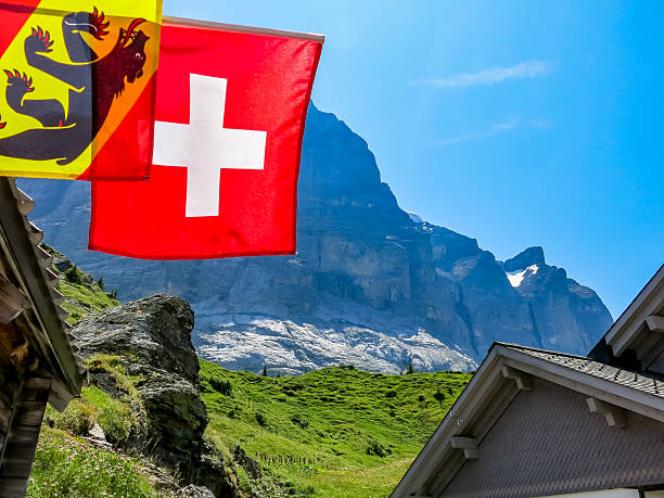 istock View up to eiger with foreground swiss flag 635715492