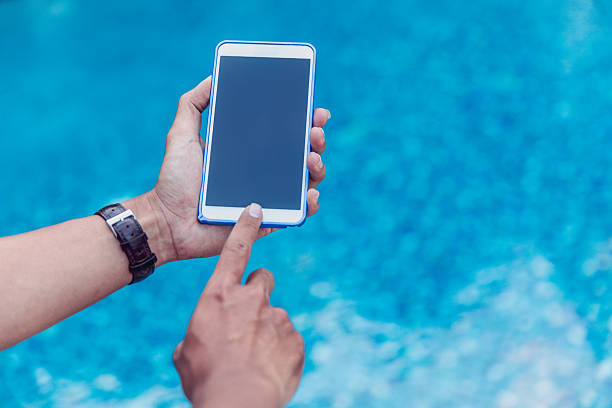 istock Adult man touching smartphone screen 635716298