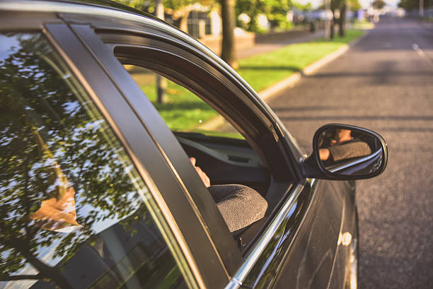 istock Woman driving a car 635716302