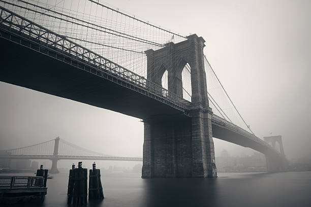 Brooklyn Bridge Brooklyn Bridge in a foggy day in downtown Manhattan brooklyn bridge photos stock pictures, royalty-free photos & images