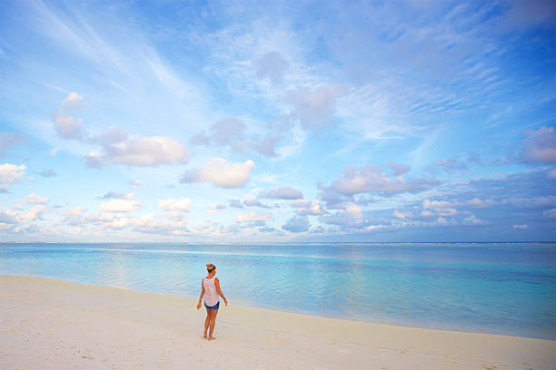istock Girl on a serene tropical beach 635718734