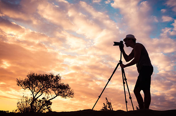 Male photographer taking photos in a beautiful nature setting.