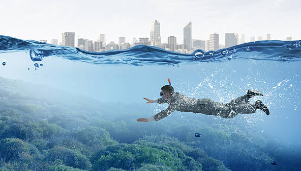 istock Diving in water businessman . Mixed media 635719938