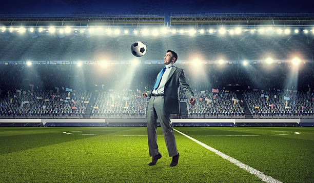 istock Businessman playing soccer . Mixed media 635720222