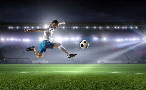 istock Soccer player kicking ball . Mixed media 635721184